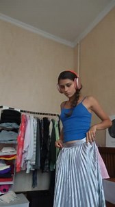 Displaying Her Vibrant Style Young Woman Trying Her Attire While