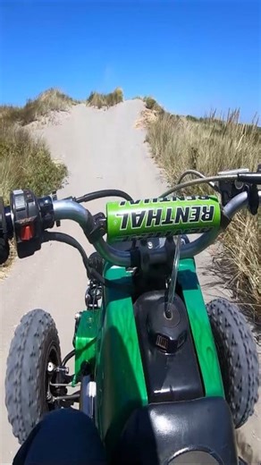 Banshee sport quad riding in the sand | TrailBlogger