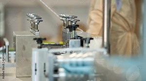 Production of medical masks - the machine makes threads for ear loops on the mask