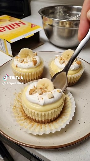 Mini Banana Pudding Cheesecakes Ingredients: For the Crust: 1 ½ cups finely crushed Nilla wafers (about 45 wafers) 5 tablespoons unsalted butter, melted 1 tablespoon granulated sugar .................. 🤍 Want ALL my recipes? Comment “Yes” ⬇️ 📖 Ebook link in my bio #mealprep #quickmeals #EasyRecipe #dinnerideas #homecooking