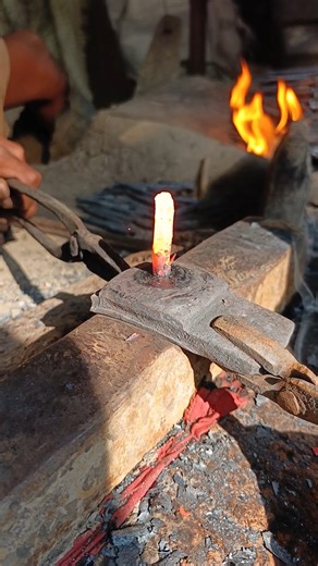 Watch how an old piece of iron is hammered and forged into a nail by hand."