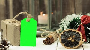 Box with twine and tag, background with copy space. Chroma key. Christmas card. View from above. Copy space - image. Camera zoom