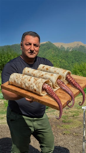 Wilderness Cooking | 🍋YouTube Channel 6M+ on Instagram: "🐙 Grilled Octopus Doner Kebab – Spit-Roasted, Charcoal Finish! 🌯 I clean a whole octopus, tenderize with citrus, rotisserie-roast it over charcoal, thin-slice doner style, and wrap it into a juicy shawarma. . . . . #viral #reels #epic #giant #wildfood #cooking #outdoor #reelstagram #reelsoftheday #explorepage #naturefood #catchandcook #recipe #octopus #villagelife #octopuscooking #recipeoctopus #reelscooking #foodie #tasty #octopusfood 