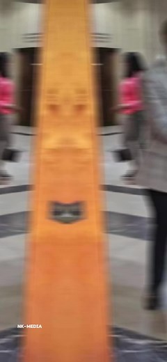 Man in Suit Walks Through Members' Lounge Area