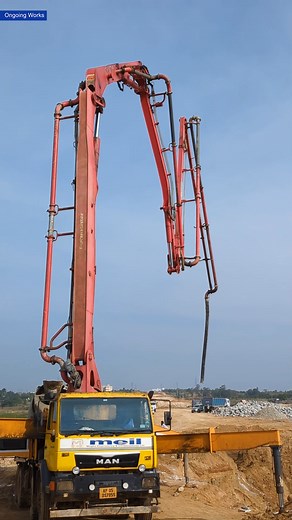 A boom placer is a modern machinery that helps with precise and efficient concrete pouring. Watch a boom placer in action at one of MEIL’s project sites. #boomplacer #concretework #roadconstruction #machinery #concreteconstruction #meghaengineering | Megha Engineering and Infrastructures Ltd