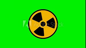 Animated radiation spinning around. Nuclear sign symbol rotate around isolated on green background. Yellow radioactive sign rotates on a green background.