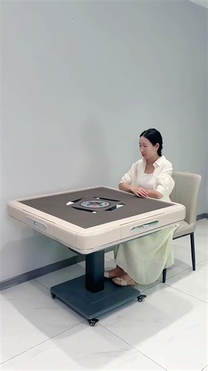 This is an automatic mahjong table. Automatic captions foldable table philosophy opereting system