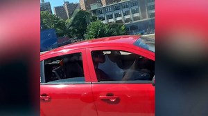 Watch as a backward-driving motorist zooms by other drivers