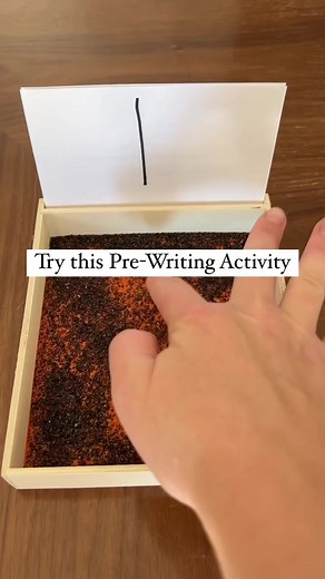 Mastering Pre-Writing Skills: Fun Sand Writing Activity for Children