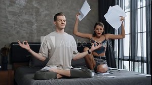 Young man doing mindfulness and peacefulness meditation ignoring problem while his wife or lover yelling with frustrated and upset expression. Marriage problem ignorant lifestyle. Adit