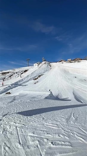Skiing Tricks in a Pristine Snowy Mountain Landscape