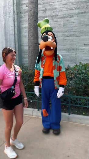 Goofy Dancing with Hotdog in Disney World