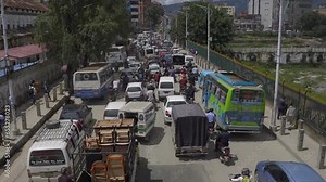 Traffic and pedestrian traffic during rush hour in Kathmandu, Nepal