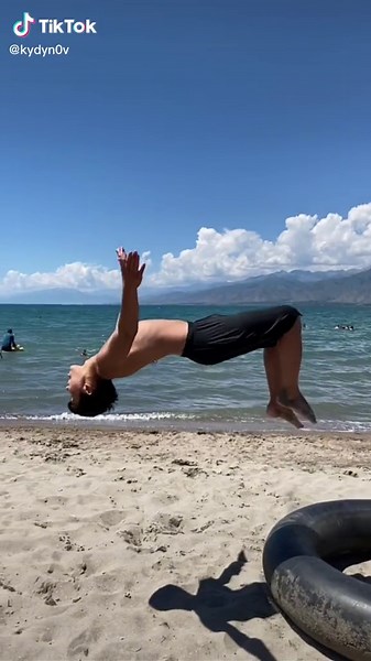 Acrobatic Beach Flips: Showcase of Strength and Agility