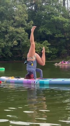 Headstand on the Retro Elite Paddle Board from Glide SUP.