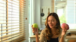 Nutritionist woman woking with fruits at her desk.