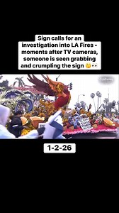 Sign calls for an investigation into LA Fires - moments after TV cameras, someone is seen grabbing and crumpling the sign 🤔👀 #losangeles #lafires #Angelenos | Jessica Golich