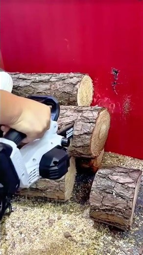 Using a Compact Cordless Electric Chainsaw to Cut Wood Logs