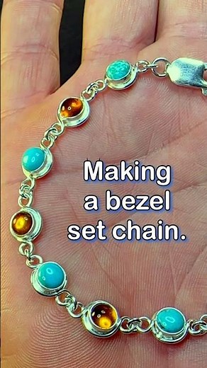 Making a bezel set chain using amber, turquoise and silver.