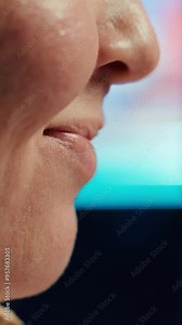 Vertical video Extreme closer up shot of happy computer engineer satisfied after futureproofing company network from system failures. Smiling IT worker pleased after managing to increase data security Stock Video