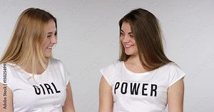 girls show girl power on their shirts