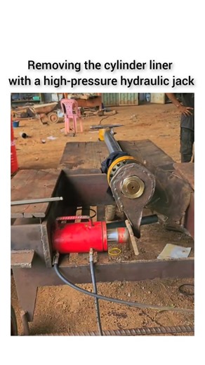 A hydraulic track pin press. It is a specialized tool used for the assembly and disassembly of track pins on heavy equipment such as excavators, bulldozers, and track loaders. | Engineering Gadgets