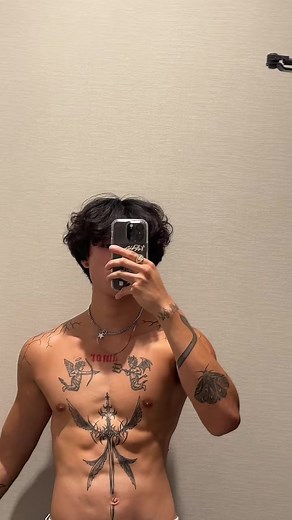 Showcasing Stunning Tattoos on a Toned Male Physique