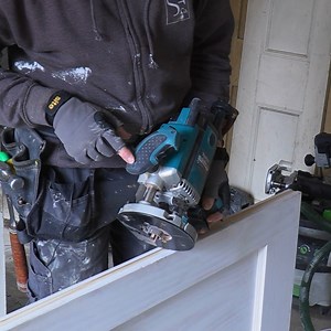 James is fitting a multi-point locking system to the doors and isn't helped by the damaged kit. New regulations require better security on new builds but it makes sense to beef up external doors. The client didn't like the idea of operating several locks and bolts so a single-action mechanism that locks the door in three places was a better solution. #carpentry #doorfitting #diy | Skill Builder