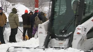 Buffalo Bills fans remove snow aheads of Bills-Chiefs game