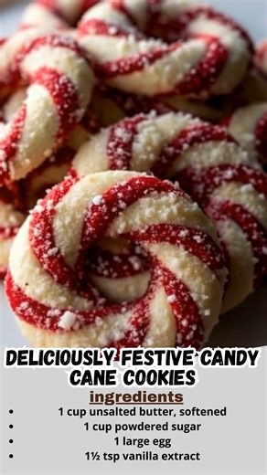 Deliciously Festive Candy Cane Cookies | Buttery, Swirled & Holiday-Perfect 🎄🍭 These candy cane cookies are a Christmas classic — tender, buttery, with a hint of peppermint and that fun red swirl that makes them almost too cute to eat! Almost 😉 Ingredients: 1 cup unsalted butter, softened 1 cup powdered sugar 1 large egg 1½ tsp vanilla extract ½ tsp peppermint extract 2½ cups all-purpose flour ½ tsp salt Red food coloring Crushed peppermint candies or candy canes (for sprinkling) Instructions