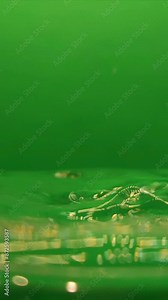 Water splash on green background. Splashes On Green Screen. Shot of Water Splash Isolated on green screen Vertical Super Slow Motion Video. Stock Video