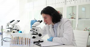 Lass test tubes with food additives cereals and grains in laboratory. Qualitative and quantitative determination of genetically modified organisms GMO of plant origin
