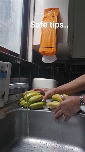 wasing the fruit to remove chemical used in ripening