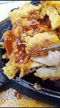 Sizzling Perfection: The Allure of Fried Chicken Steak on a Hot Plate