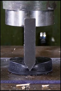 Hockey Puck vs Hydraulic Press Spike