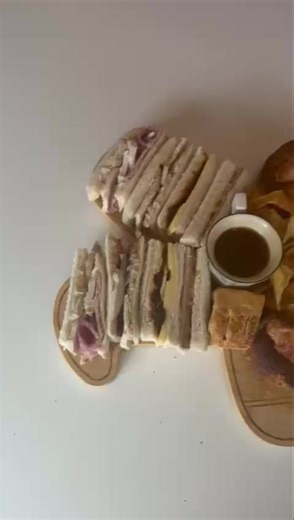 Full video of our adult Christmas afternoon teas This is for 4 adults Sandwiches Chicken and bacon Turkey cranberry and stuffing Cheese and pickle Beef Homemade Yorkie and pigs in blankets with dipping gravy Sausage roll Scone with clotted cream and jam Toffee cupcake Choc orange brownie Santa cheesecake Lemon white choc and raspberry loaf Washed down with glass of prosecco (Alcohol free ) Tea/coffee £17pp | Rose's Tea Room