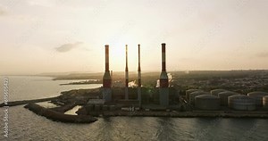 In the Grip of Pollution: A Gripping Aerial Cinematic Encounter Exposing the Hazards of Power Plant Emissions on Our Air Quality. High quality 4k footage