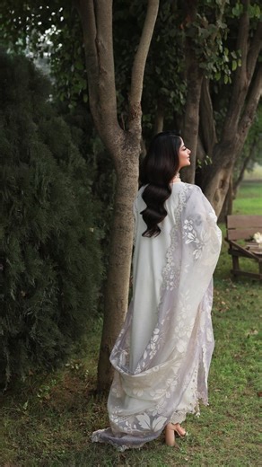 @sardinia.pk on Instagram: "Cloud Whisper | Code# 1505 A Embroidered lawn front with laser work, detailed with hand-worked organza neckline and chaak & hem patti, paired with a solid dyed lawn back. Finished with embroidered chikankari sleeves with organza borders, an embroidered and paste-printed woven-net dupatta on a gradient base with organza pallu, and a solid cotton trouser accented with an embroidered border. #SardiniaOfficial #LuxuryLawn2026 #HandworkElegance #Appliquework #TalesofPetals