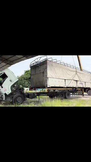 Loading a Large Container onto a Truck: Step-by-Step
