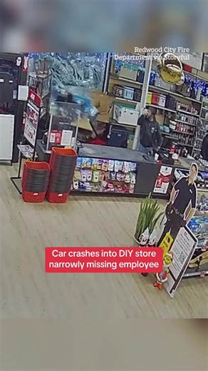 Shocking footage has emerged showing the moment a car crashed into a DIY store, narrowly avoiding an employee and sparking a fire. #fire #crash #carcrash #worldnews