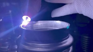 Process of argon welding flexible stainless steel pipe with nozzle close-up.