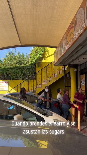 Exploring a Vibrant Yellow Building with Menu Sign