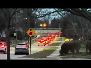 A BNSF ES44C4 leads NS 315 through ￼elmwood with another BNSF ES44C4 as a mid train DPU