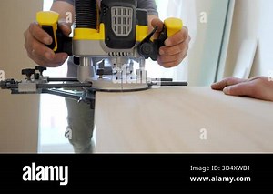 Wood router in action smoothly cutting into a wooden surface. shot highlights woodworking craftsmanship. High quality 4k footage