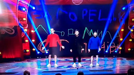 Vibrant Dance Performance with Colorful Backdrop