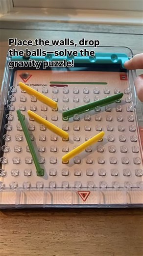 Comment to find out where to buy the game! Tumble Maze by Blue Orange Games is the gravity-powered solo logic puzzle that has players strategically placing walls to guide steel balls through a pegboard maze. Choose one of 40 challenges (from beginner to expert), set up the pegs, slide the maze upright, drop the balls, and adjust until each ball lands exactly where the challenge card indicates ￼. No scorekeeping—just pure puzzle focus. Key benefits: improves spatial reasoning, visual perception, 