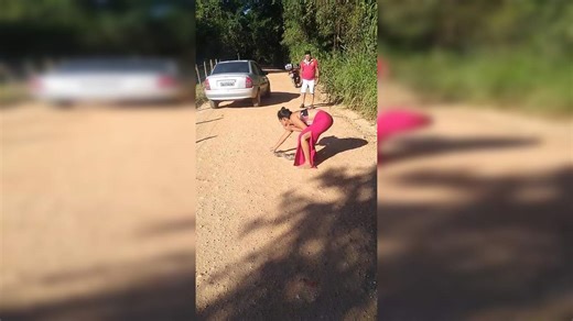 Viral video: Brazilian woman dexterously removes snake while smoking cigarette with one hand