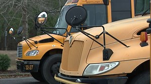 Teacher, father of 4 dies after being pinned between 2 school buses