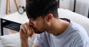 Sad crying man suffering with depression