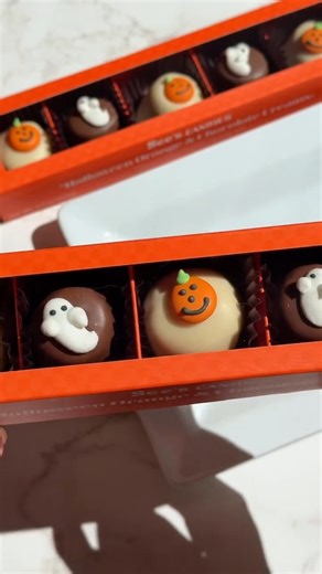 👻🎃 A boo-tiful bite! Our seasonal Orange & Chocolate Creams are all dressed up for Halloween — with candy ghosts & grinning pumpkins on every piece. Grab yours before they vanish! 🍫✨ | See's Candies